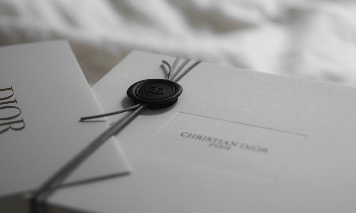 Dior gift box with wax seal and ribbon