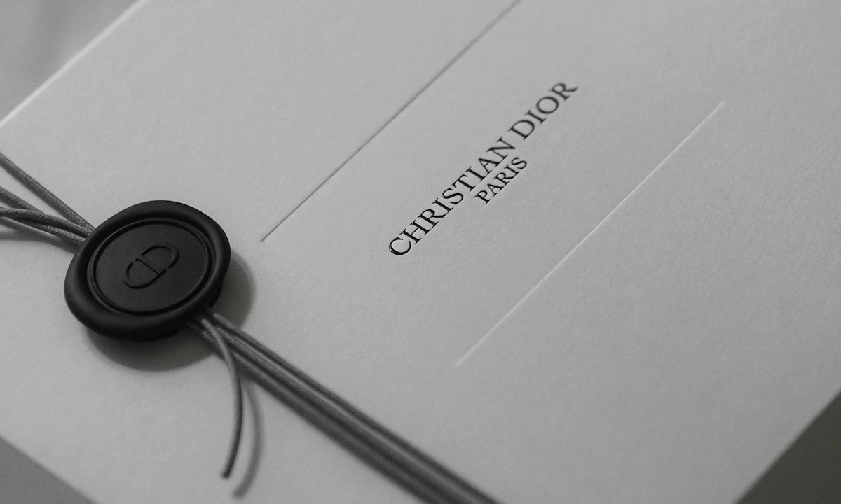 White christian dior gift box with ribbon and wax seal