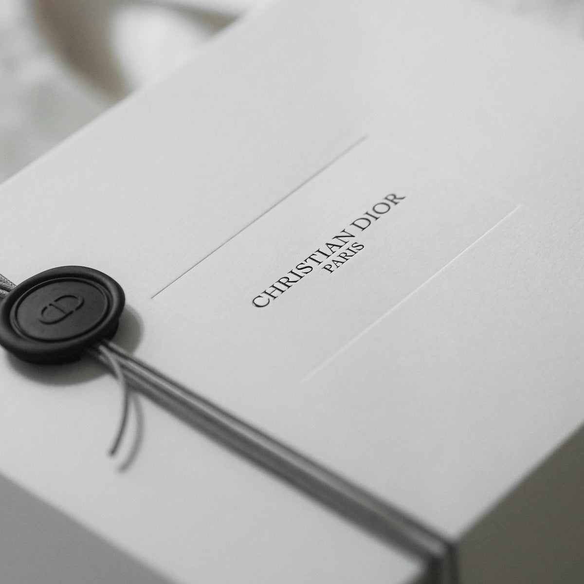 White christian dior gift box with ribbon and seal